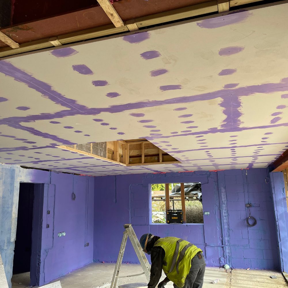 Passive Purple Brush being applied to seal building joints for airtightness during a London retrofit project.